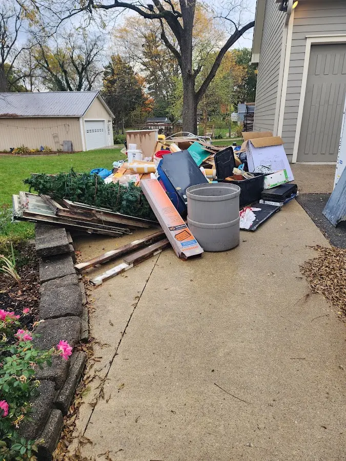 Dumpster being loaded with debris for Commercial Dumpster Rental in San Rafael
